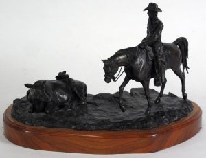 Don Toney: COWBOY APPROACHING A COW AND CALF