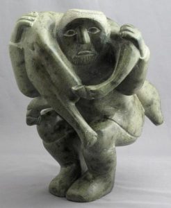 Unidentified Inuit Artist: HUNTER CARRYING A POLAR BEAR CUB