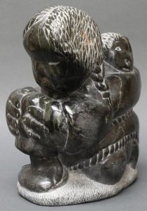 Johnny Inukpuk: INUIT MOTHER STRETCHING KAMIK