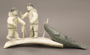 Unidentified Inuit Artist: TWO HUNTERS WITH SEAL